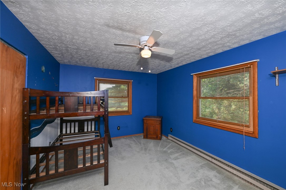 3079 Stroup Road Atwater, OH 44201 - Photo 26 of 40 Welcome to 3079 Stroup Rd, Atwater, OH 44201-9105 - The second bedroom with windows overlooking the side and front yards.