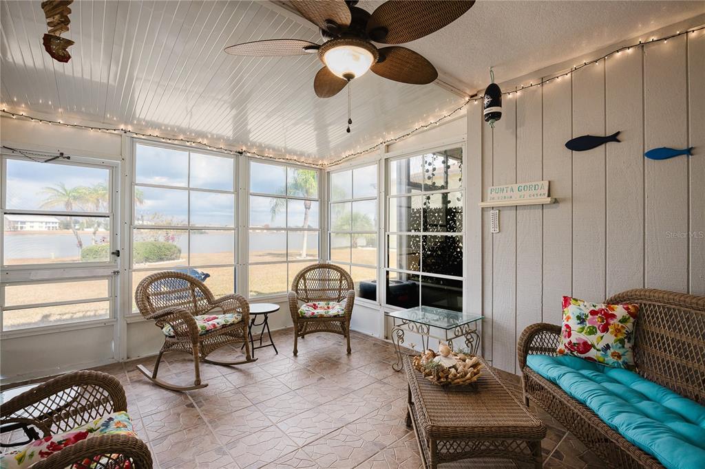 26282 Rampart Boulevard, Unit 204 Punta Gorda, FL 33983 - Photo 2 of 34 a living room with furniture and a window