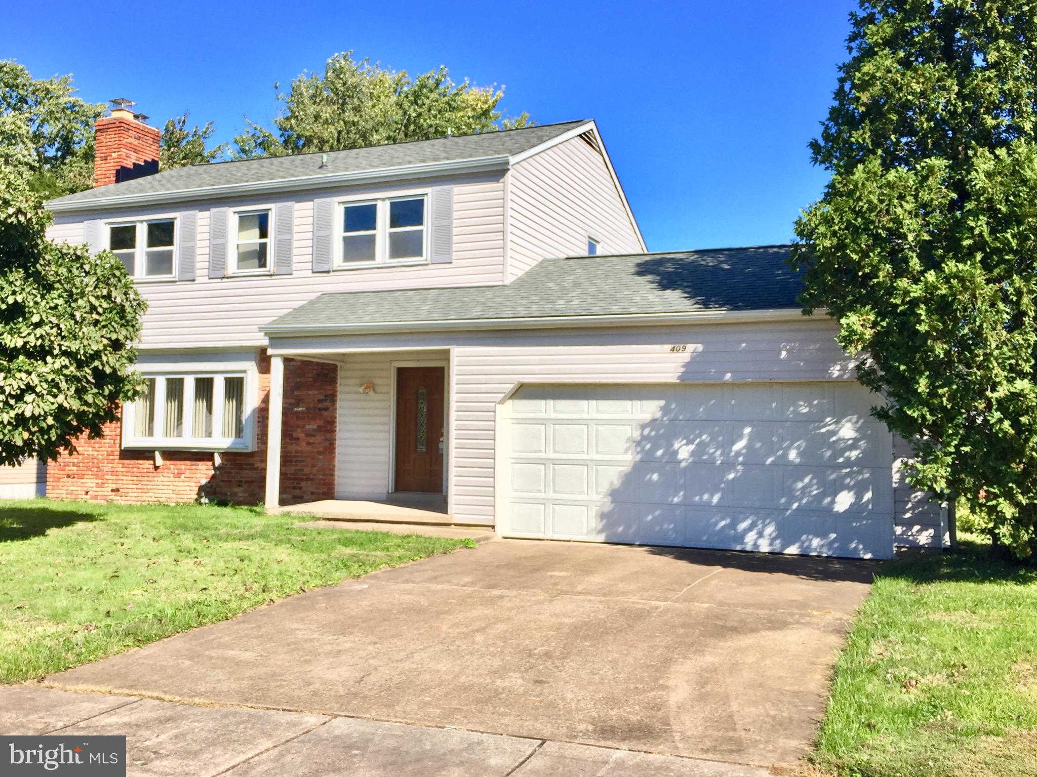 409 Latimer Road Joppa, MD 21085 - Photo 1 of 30 Concrete driveway with new garage door