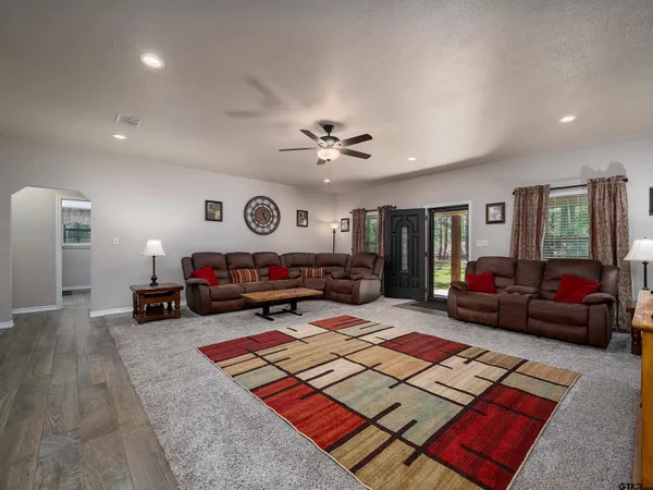 a kitchen with stainless steel appliances granite countertop wooden cabinets a stove top oven a sink and dishwasher