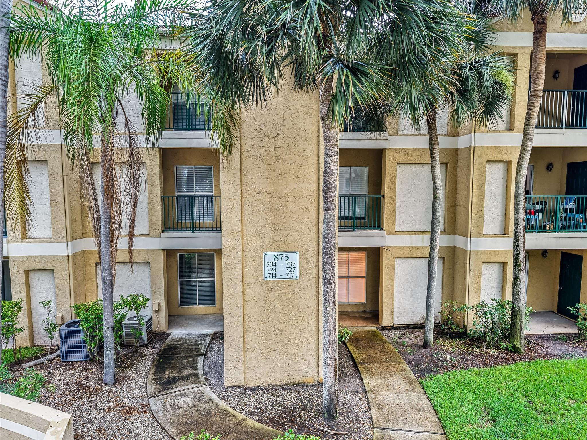 a front view of house with a garden
