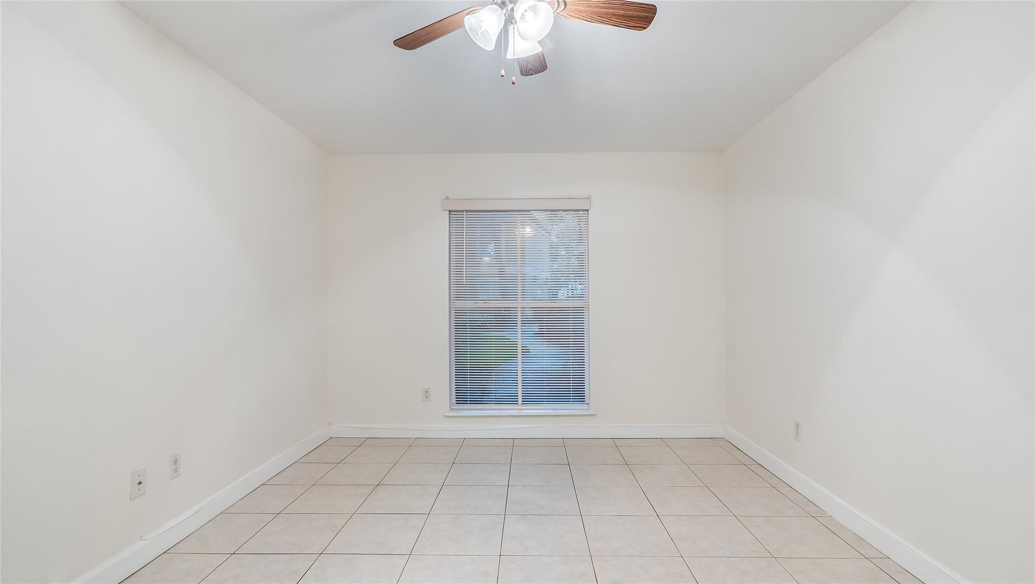875 Riverside Drive, Unit 717 Coral Springs, FL 33071 - Photo 14 of 31 an empty room with a empty space and windows