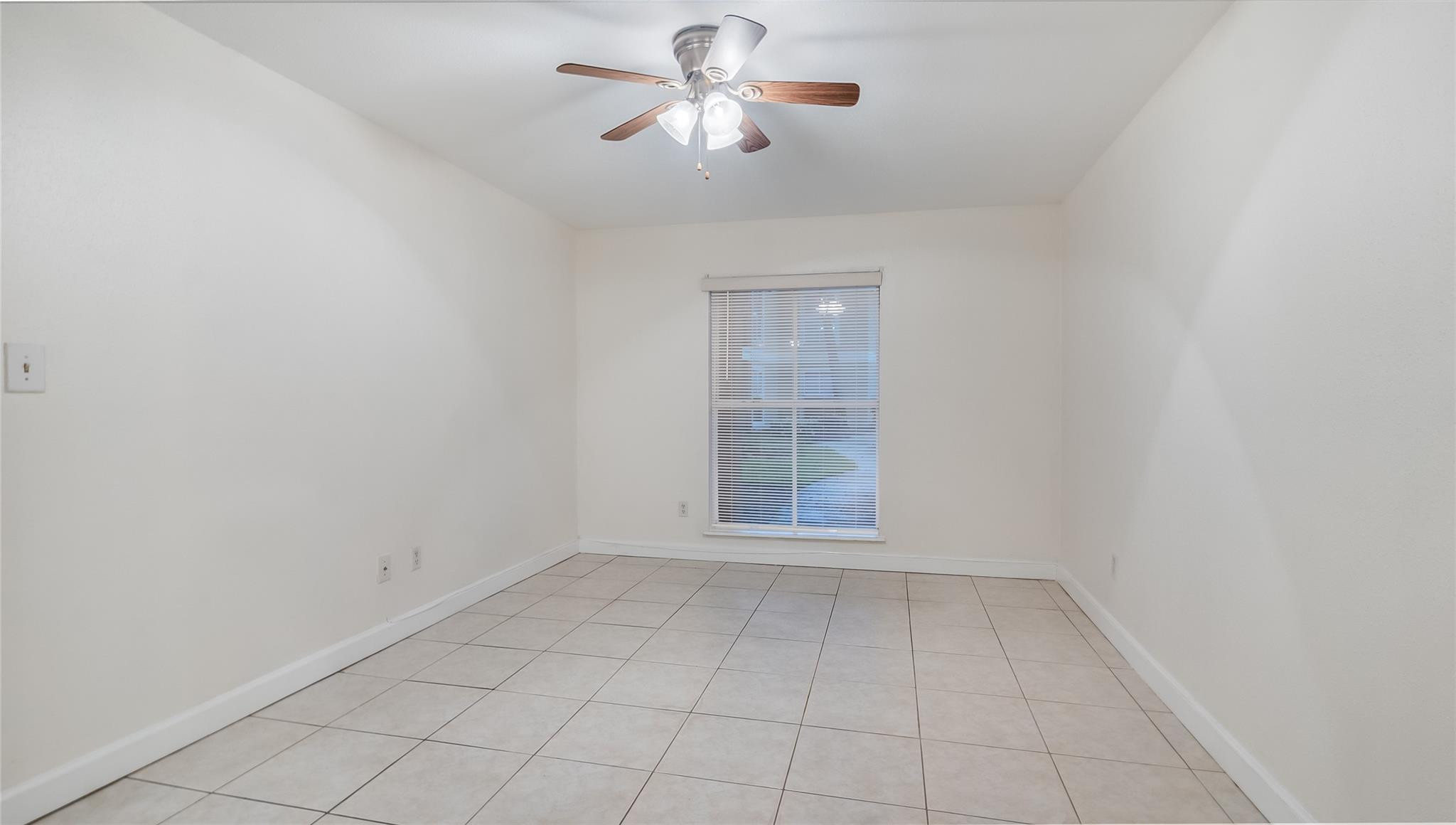 875 Riverside Drive, Unit 717 Coral Springs, FL 33071 - Photo 20 of 31 wooden floor in an empty room with a window
