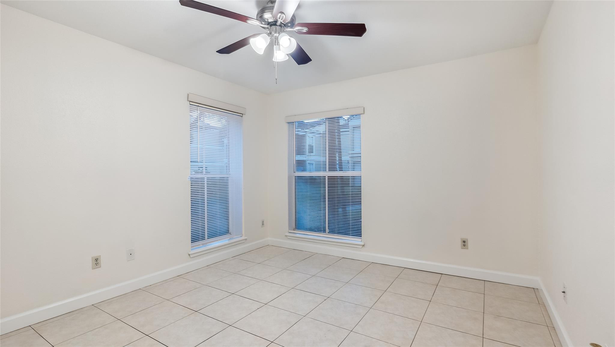 875 Riverside Drive, Unit 717 Coral Springs, FL 33071 - Photo 21 of 31 an empty room with closet and a chandelier fan