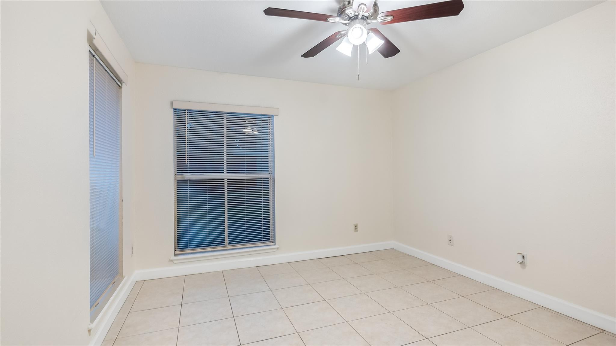 875 Riverside Drive, Unit 717 Coral Springs, FL 33071 - Photo 23 of 31 an empty room with a window
