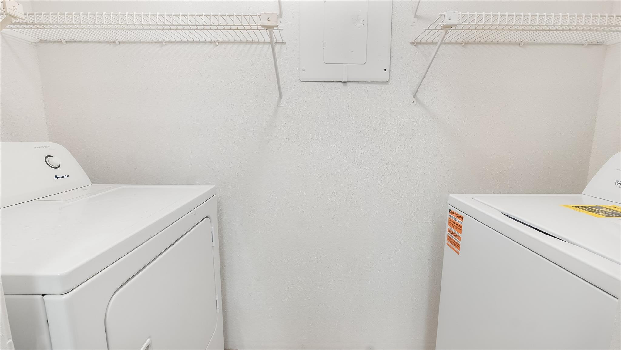 875 Riverside Drive, Unit 717 Coral Springs, FL 33071 - Photo 27 of 31 a utility room with dryer and washer