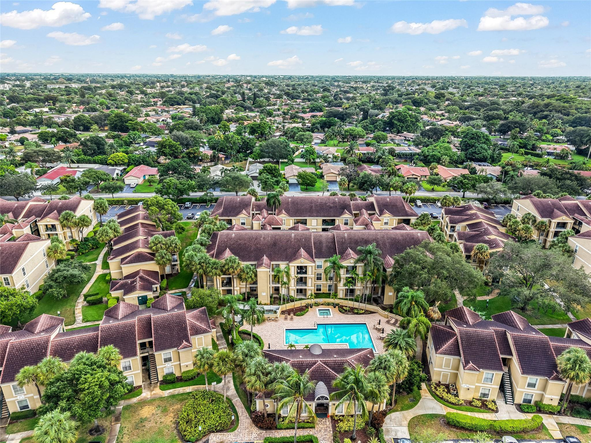 875 Riverside Drive, Unit 717 Coral Springs, FL 33071 - Photo 28 of 31 an aerial view of residential houses with outdoor space and swimming pool