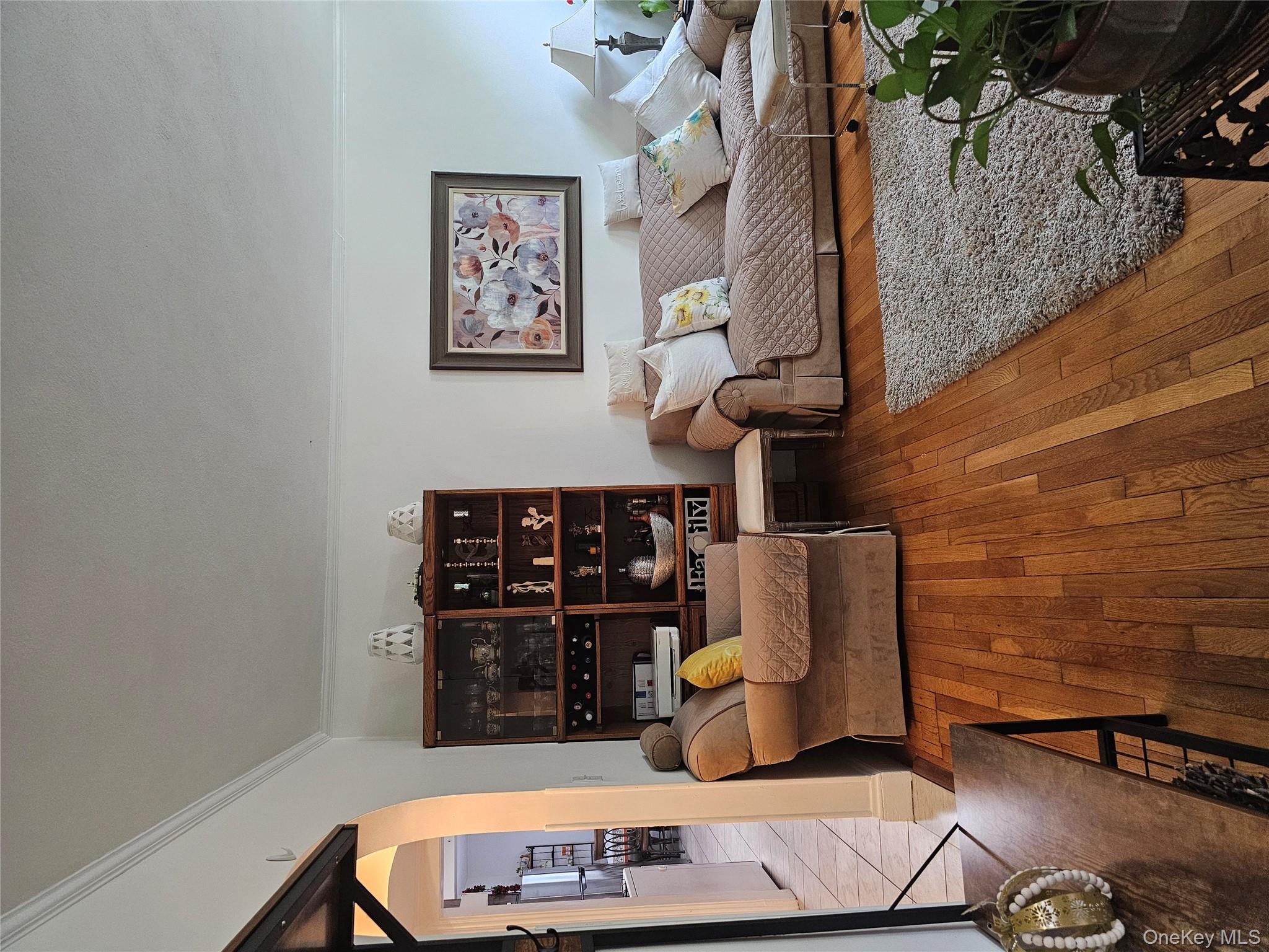 232 Doughty Boulevard Inwood, NY 11096 - Photo 2 of 11 a living room with furniture and wooden floor