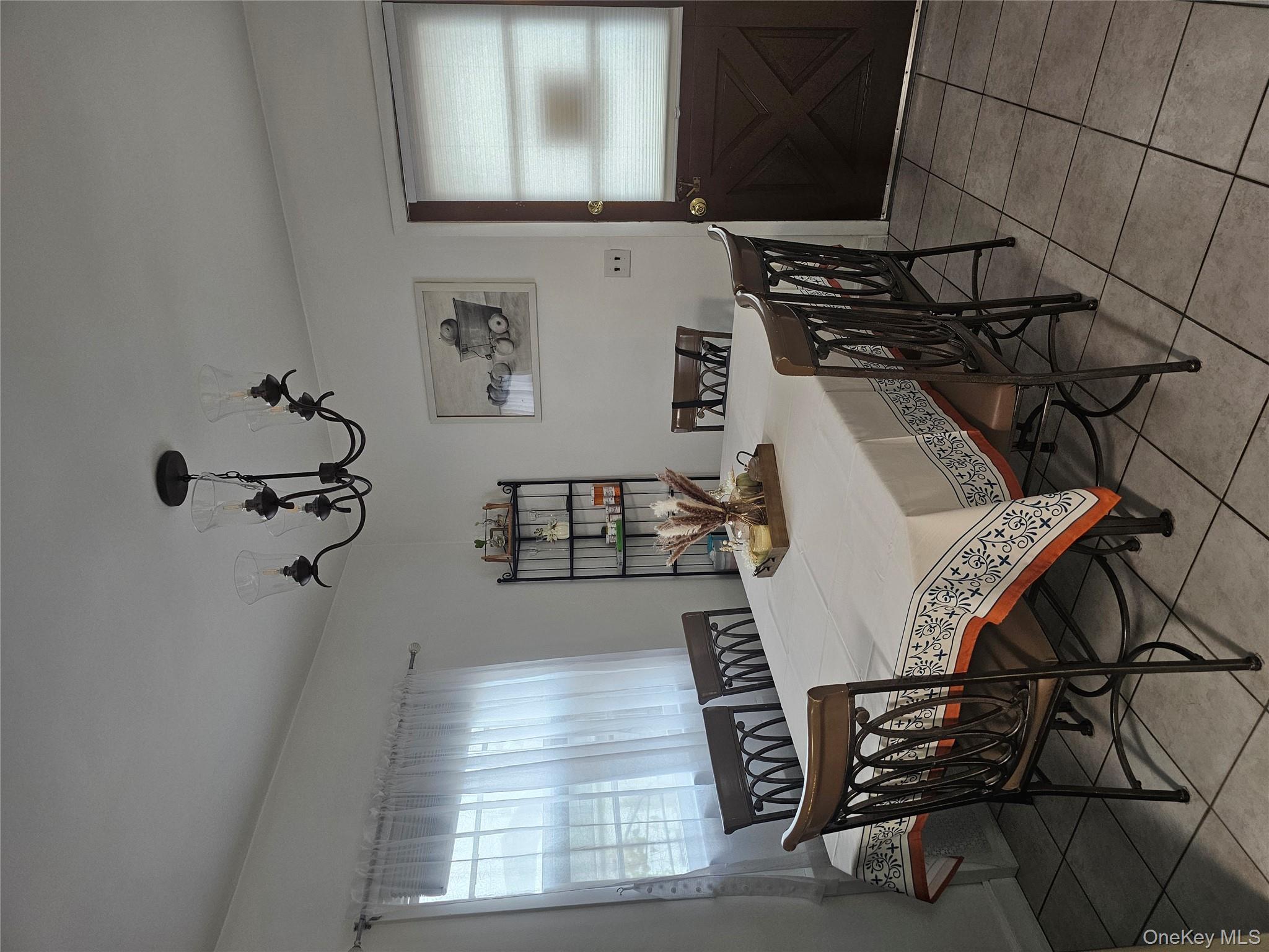 232 Doughty Boulevard Inwood, NY 11096 - Photo 4 of 11 a view of a dining room with furniture