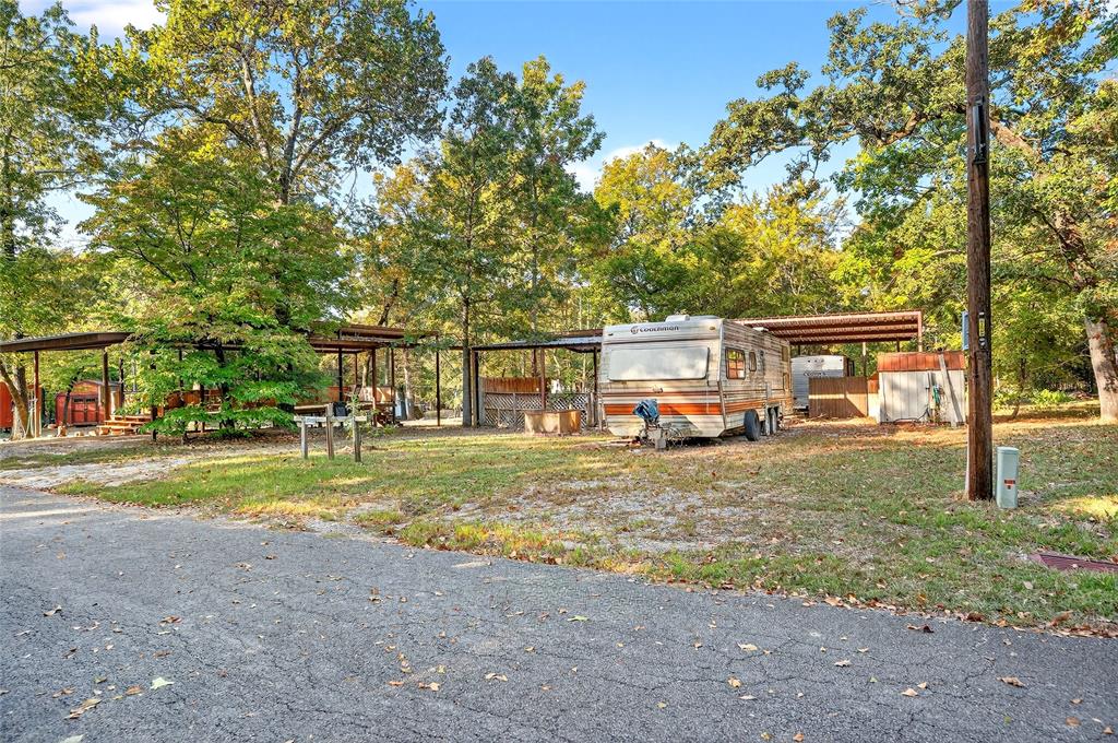 Lot 135-136 Private Road, Unit 5819 Yantis, TX 75497 - Photo 11 of 18 a view of a house with backyard and sitting area