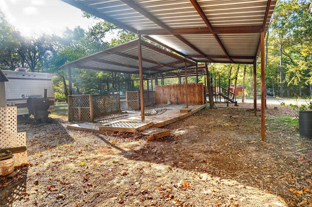 Lot 135-136 Private Road, Unit 5819 Yantis, TX 75497 - Photo 13 of 18 a backyard of a house with a table and chairs