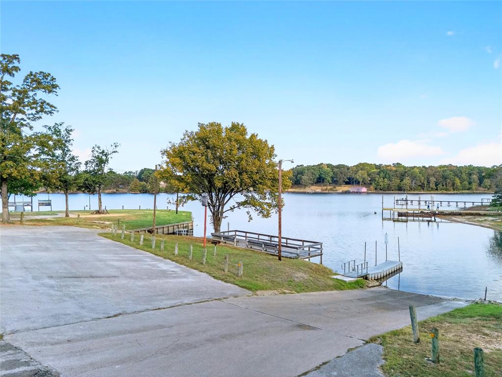 Lot 135-136 Private Road, Unit 5819 Yantis, TX 75497 - Photo 14 of 18 a view of a lake with houses