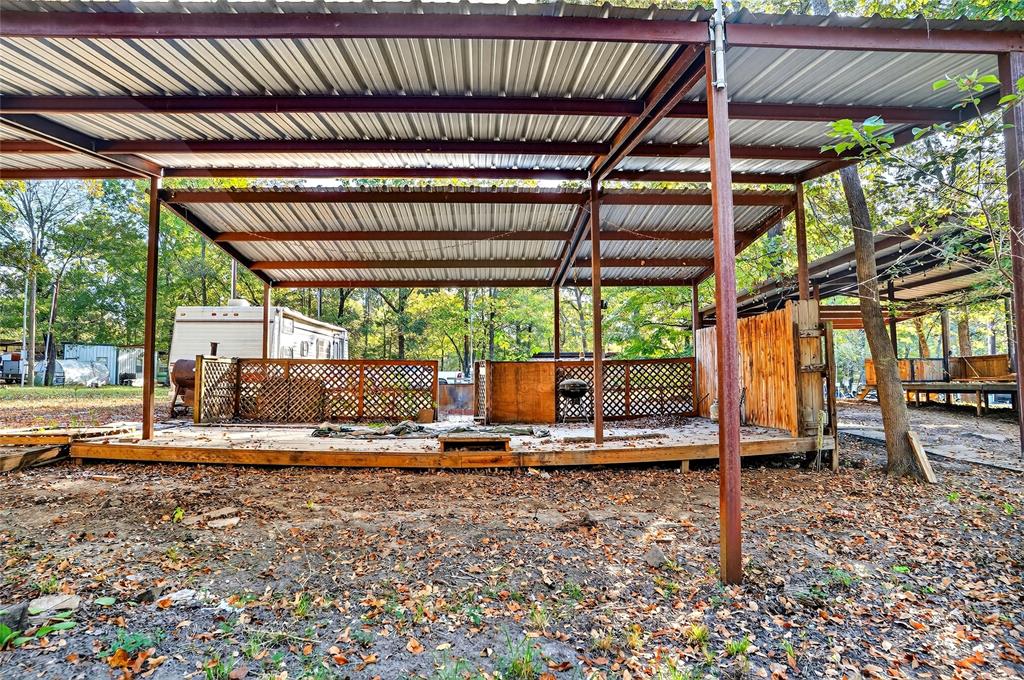 Lot 135-136 Private Road, Unit 5819 Yantis, TX 75497 - Photo 8 of 18 a view of a backyard with lawn chairs and a patio