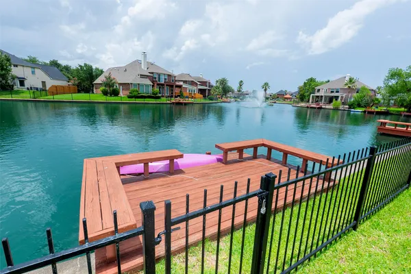 a living room with furniture fireplace and a large window