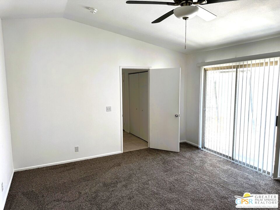 9700 Santa Cruz Road Desert Hot Springs, CA 92240 - Photo 21 of 37 an empty room with a ceiling fan and window