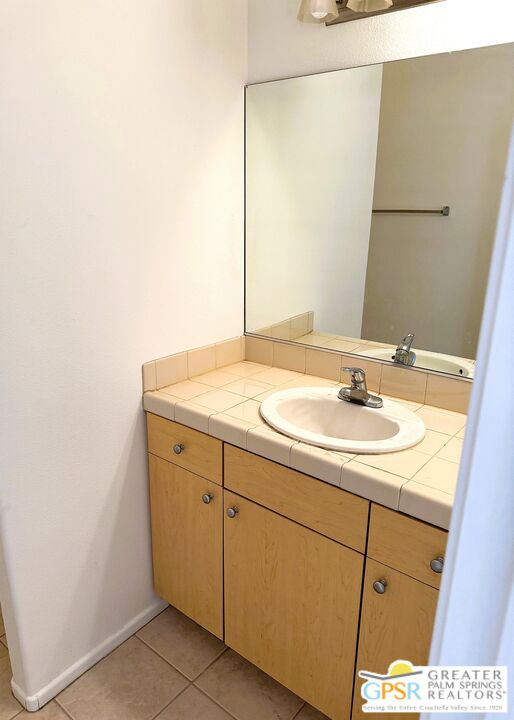 9700 Santa Cruz Road Desert Hot Springs, CA 92240 - Photo 28 of 37 a bathroom with a sink and a mirror