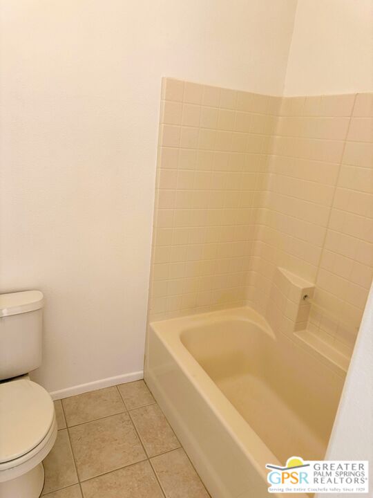 9700 Santa Cruz Road Desert Hot Springs, CA 92240 - Photo 29 of 37 a white bath tub sitting next to a toilet
