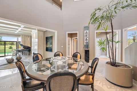 a view of a dining room with furniture window and outside view