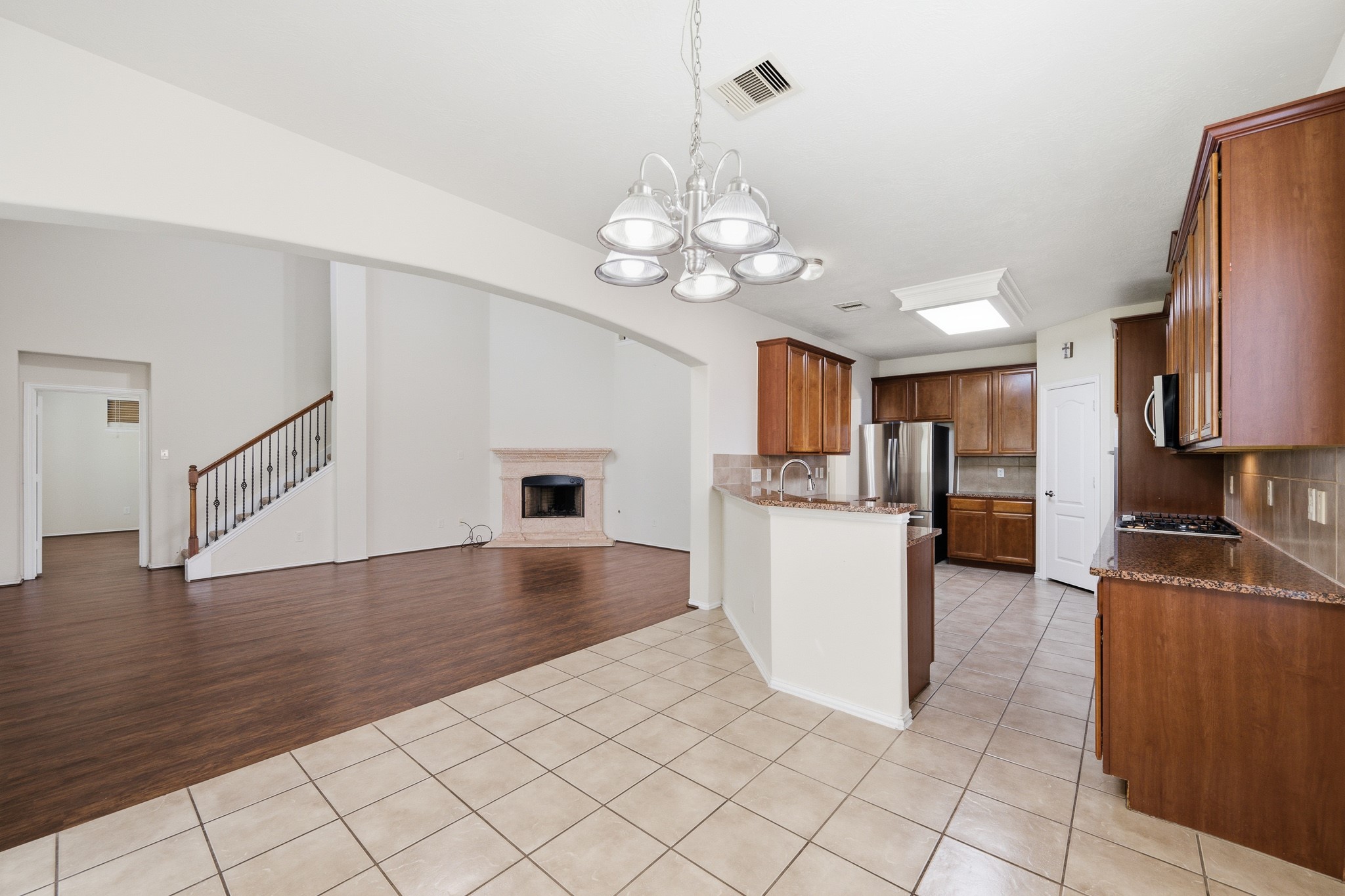 2117 Rushing Spring Drive Pearland, TX 77584 - Photo 13 of 42 The inviting breakfast area seamlessly connects to the modern kitchen and spacious living room, creating a perfect flow for daily living and entertaining.