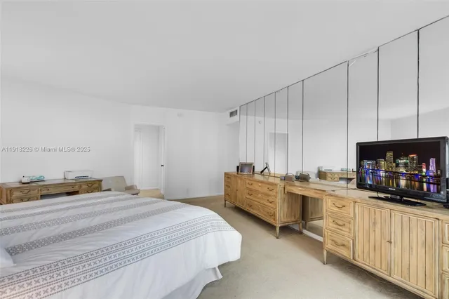 a bedroom with a bed and a cabinets