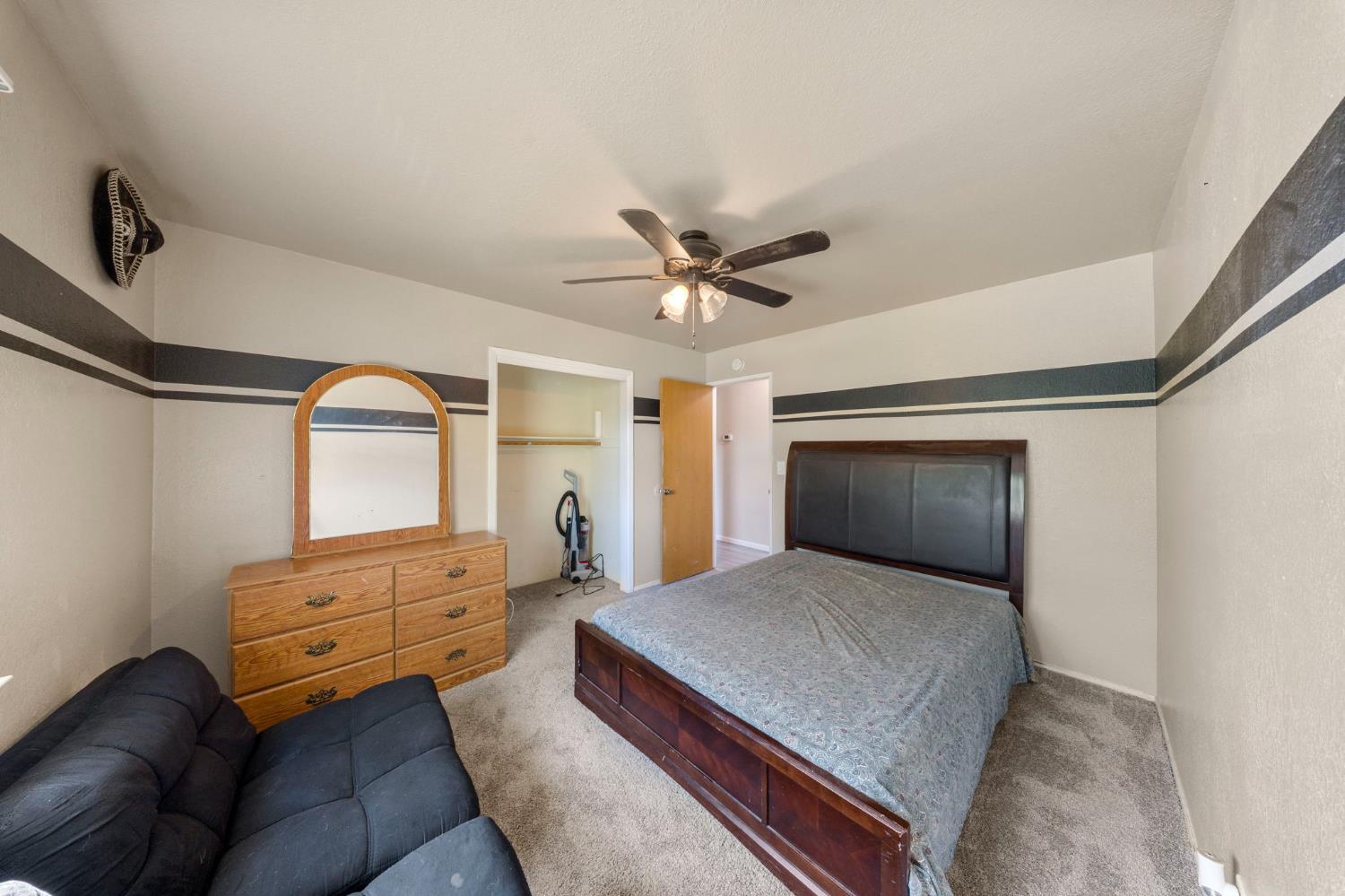 2779 Story Avenue Merced, CA 95340 - Photo 16 of 27 a bedroom with a bed and window