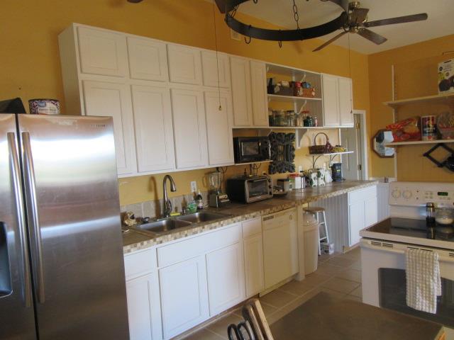 3064 Battle Creek Road Springfield, TN 37172 - Photo 11 of 30 a kitchen with stainless steel appliances a refrigerator sink and cabinets