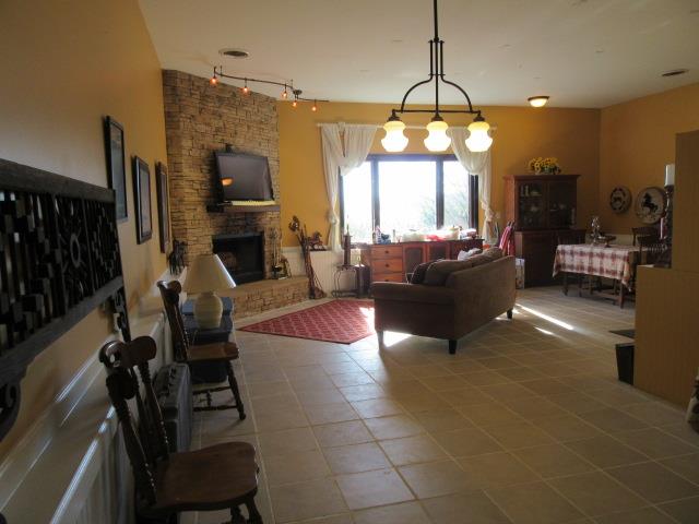 3064 Battle Creek Road Springfield, TN 37172 - Photo 7 of 30 a living room with furniture a fireplace and a flat screen tv