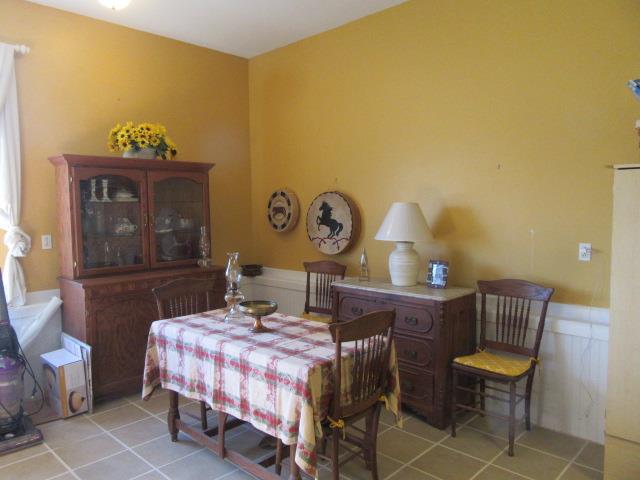 3064 Battle Creek Road Springfield, TN 37172 - Photo 8 of 30 a bedroom with a bed and a table in it
