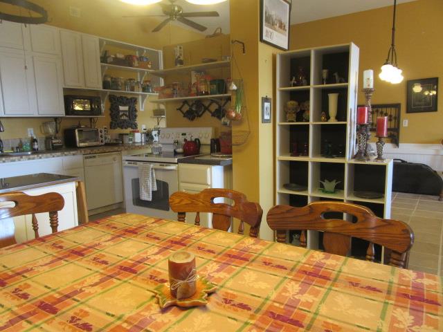 3064 Battle Creek Road Springfield, TN 37172 - Photo 9 of 30 a room with stainless steel appliances kitchen island granite countertop a sink and cabinets