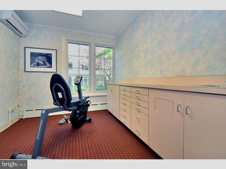 344 Penn Road Wynnewood, PA 19096 - Photo 20 of 25 a view of a workspace with furniture and wooden floor