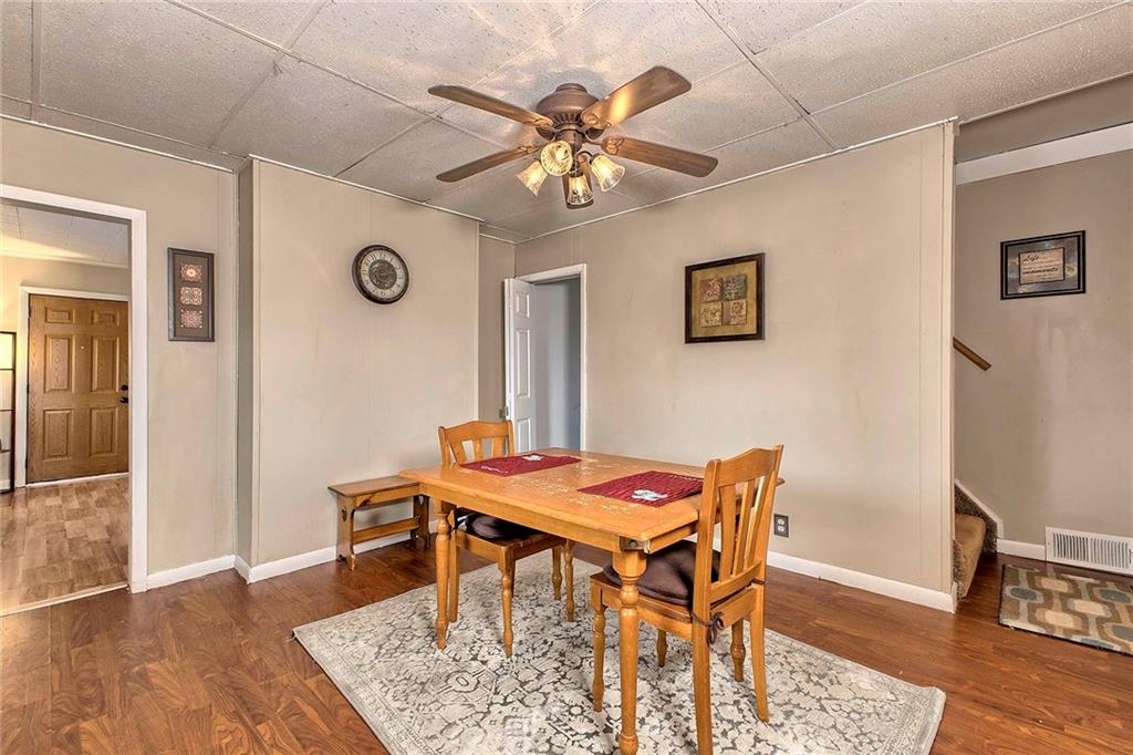 8002 Hayward Street Irwin, PA 15642 - Photo 11 of 31 a view of a dining room with furniture and wooden floor