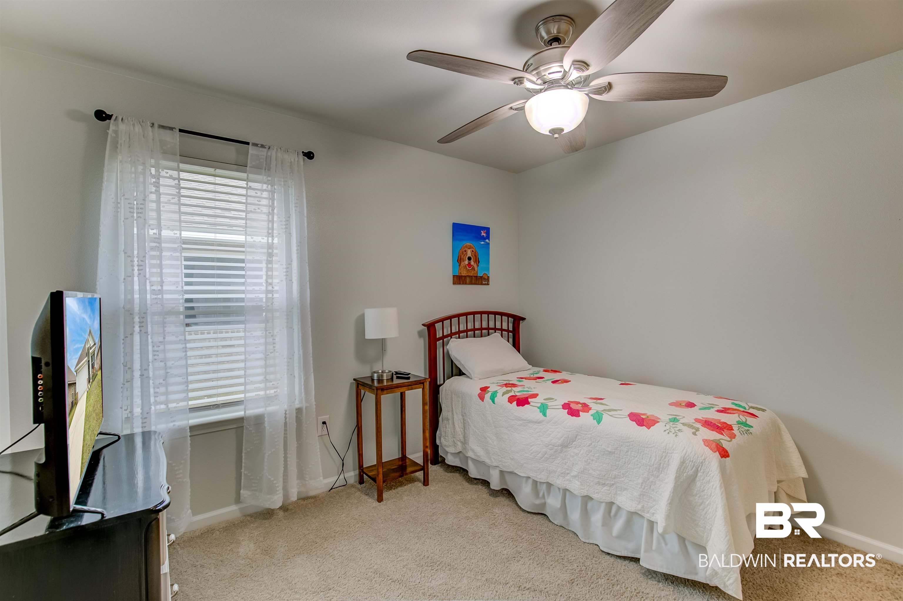 8033 Irwin Loop Daphne, AL 36526 - Photo 32 of 38 Carpeted room featuring a ceiling fan with integrated lighting, a single window with blinds, and light-toned wall finishes