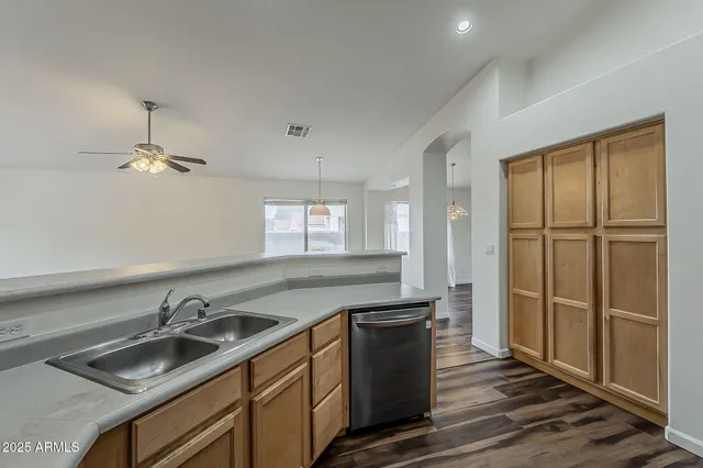 a kitchen with sink cabinets and window