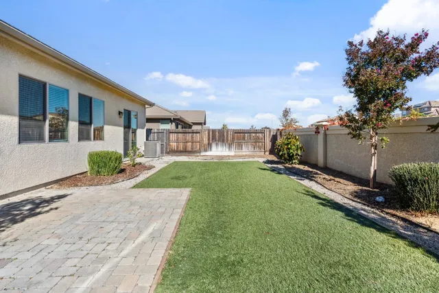 a view of a backyard of the house