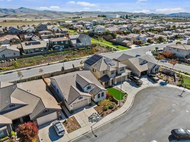 an aerial view of residential houses with outdoor space