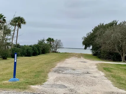 a view of a road with a yard