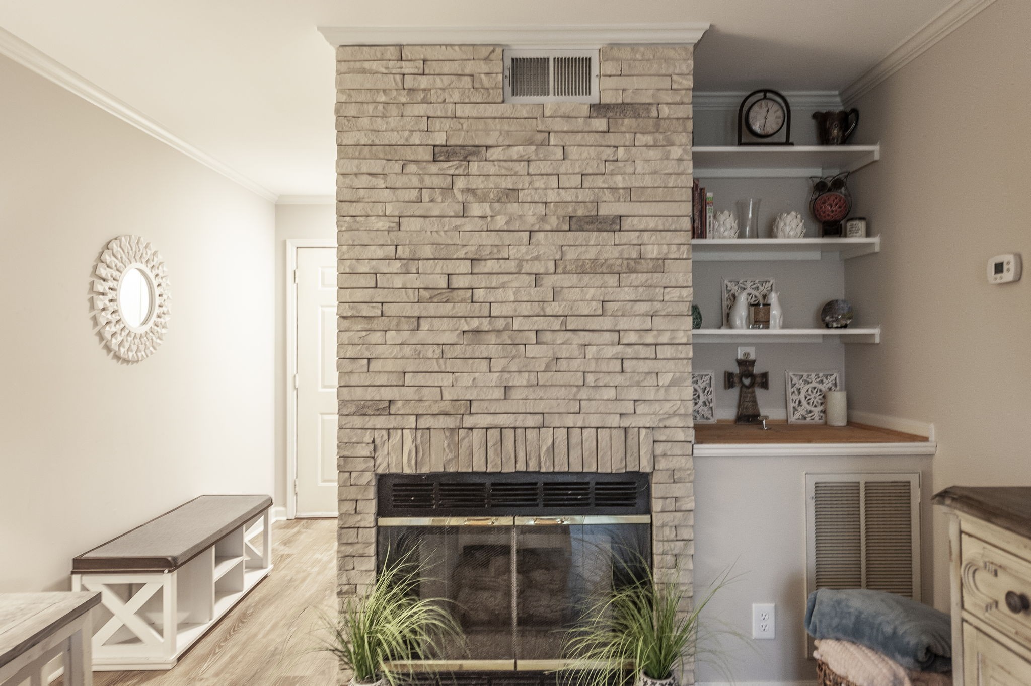 a living room with furniture and a fireplace