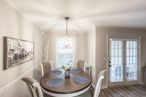205 Churchill Crossing Madison, TN 37115 - Photo 6 of 17 a view of a dining room with furniture wooden floor and a chandelier