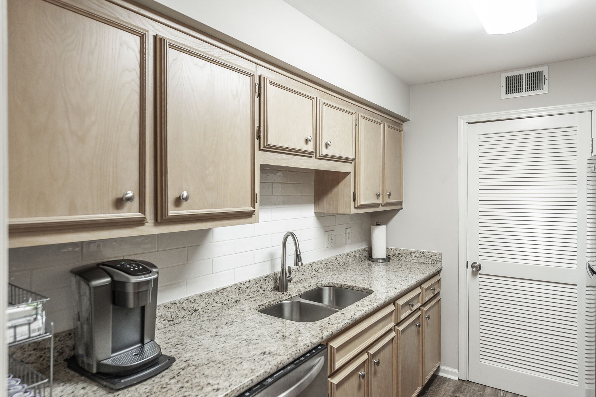 205 Churchill Crossing Madison, TN 37115 - Photo 8 of 17 a kitchen with granite countertop a sink and a window