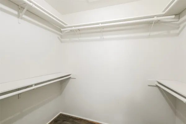 a view of a room with shelf on the wall