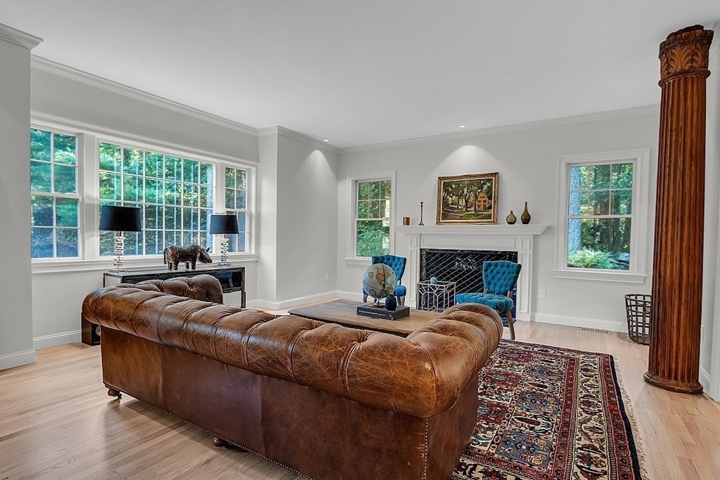 117 Channing Road Concord, MA 01742 - Photo 15 of 38 a bedroom with furniture and a fireplace