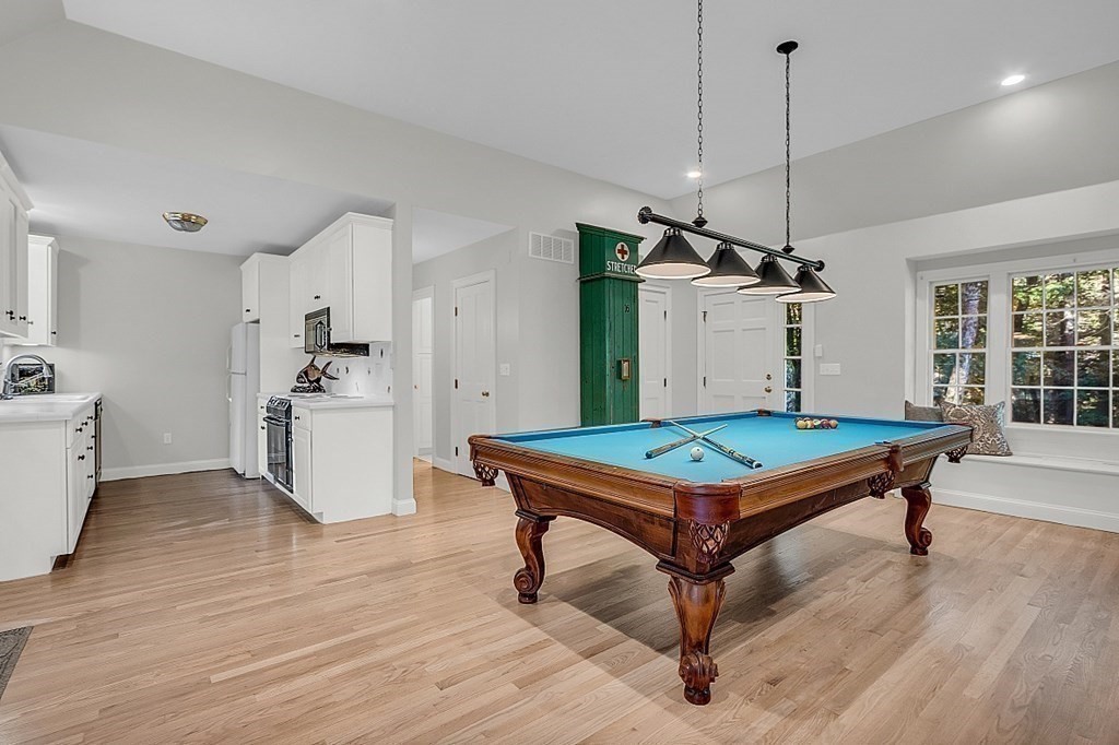 117 Channing Road Concord, MA 01742 - Photo 19 of 38 a room with wooden floors pool table furniture and windows