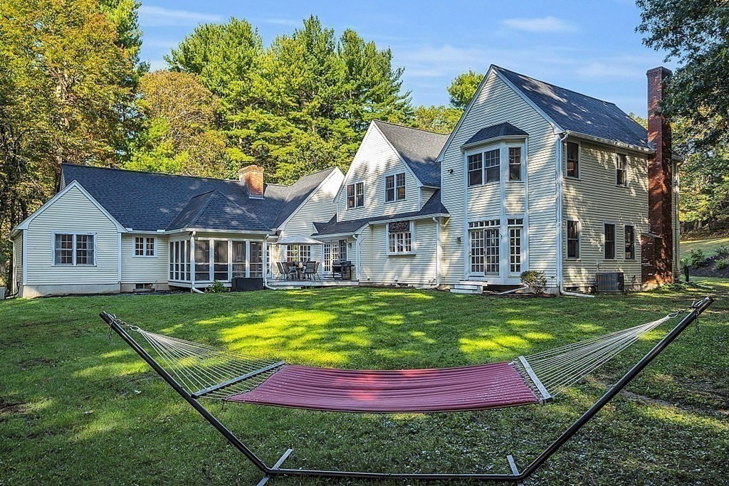 117 Channing Road Concord, MA 01742 - Photo 27 of 38 a front view of a house with yard and green space