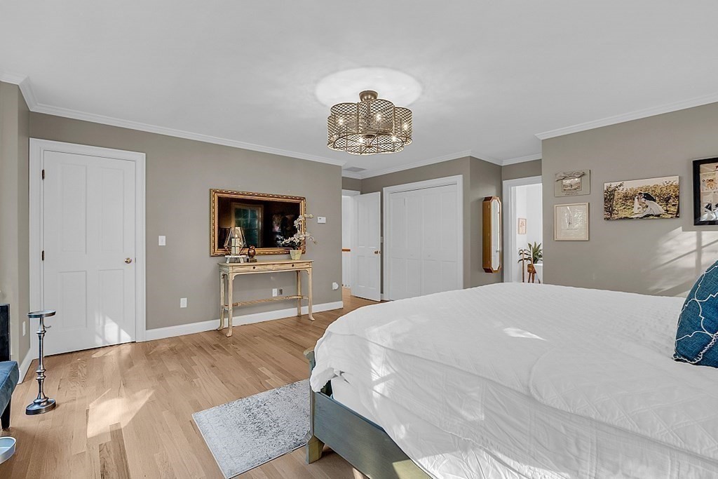 117 Channing Road Concord, MA 01742 - Photo 30 of 38 a bedroom with a bed and a flat screen tv