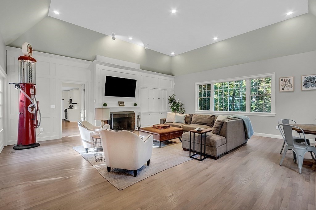 117 Channing Road Concord, MA 01742 - Photo 3 of 38 a living room with furniture a flat screen tv and a fireplace