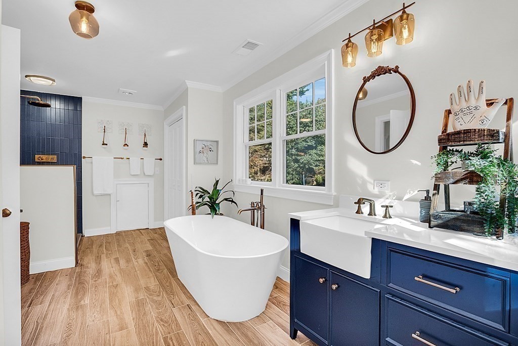 117 Channing Road Concord, MA 01742 - Photo 31 of 38 a spacious bathroom with a granite countertop tub sink and mirror