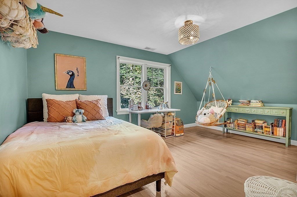 117 Channing Road Concord, MA 01742 - Photo 33 of 38 a bedroom with a bed and wooden floor