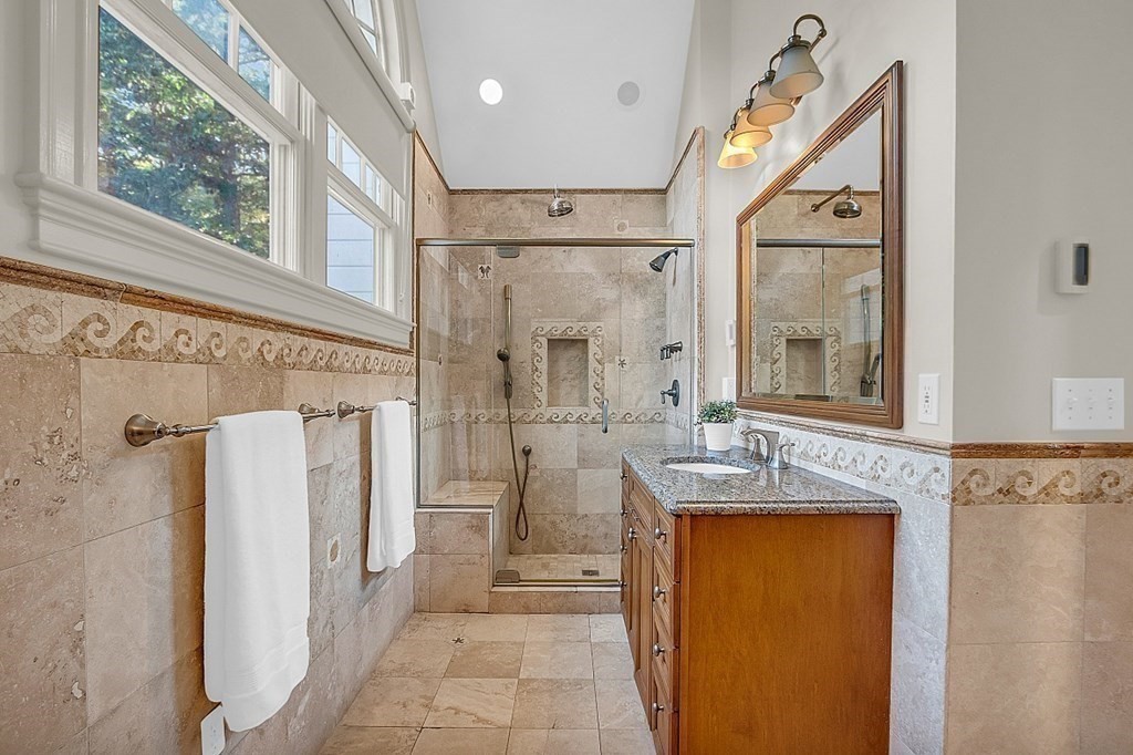 117 Channing Road Concord, MA 01742 - Photo 36 of 38 a bathroom with a granite countertop sink and a mirror