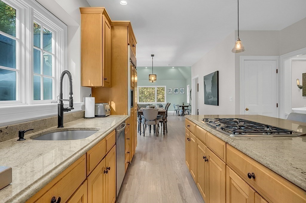 117 Channing Road Concord, MA 01742 - Photo 7 of 38 a kitchen with stainless steel appliances granite countertop a sink stove and cabinets