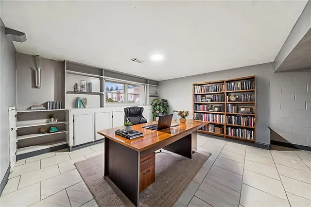 a view of workspace with furniture and cabinet